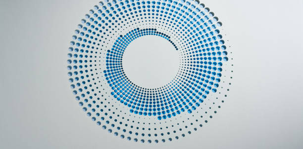 Native image size: 10760 x 5304. This minimalist still life photograph features a circular paper cutout design set against a white background. The artwork consists of concentric circles of meticulously arranged holes, transitioning through a gradient of blue hues. The simple yet elegant design highlights the intricate craftsmanship and the smooth gradient effect. The contrast between the crisp white background and the blue gradient enhances the visual appeal, making this piece a striking example of modern paper art.