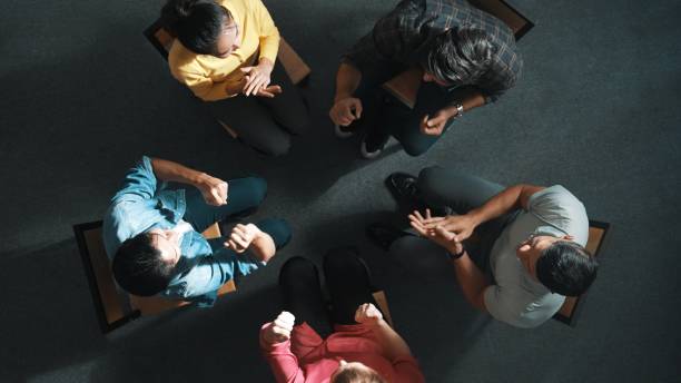 istock Top down view of business people clap hands together while sitting. Symposium. 2159551489