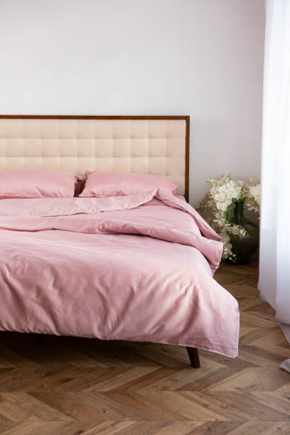 istock Morning messy on bed and pink cotton textile room 2159551582