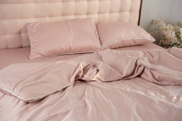 istock Beige fabric textile cotton mornung messy bed linen 2159551617