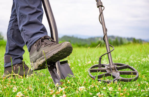 istock Treasure hunter with a metal detector in the mountains. 2159553399