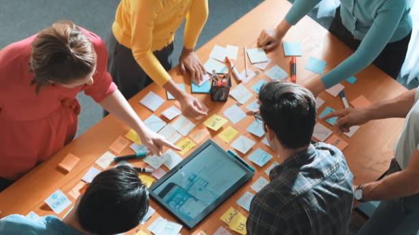 istock Top view of business people working together to design web design. Symposium. 2159554070