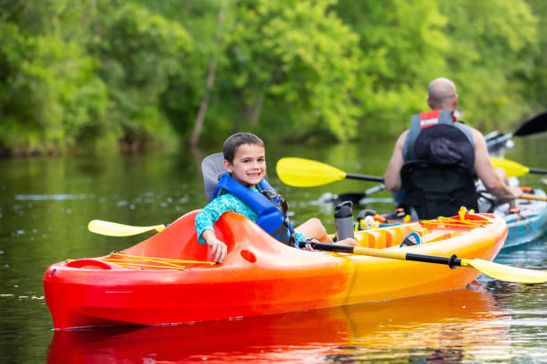 istock Family Kayaking on River on Summer Evening 2159554866