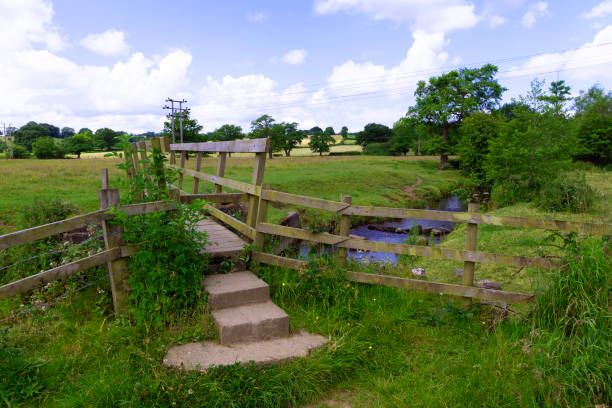 Pastoral landscape view, by a wooden bridge, in Stretton, Derbyshire.