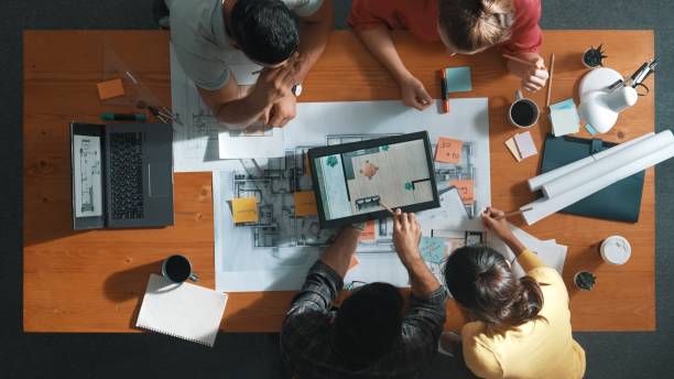 istock Top down view of civil engineer planning and writing at blueprint. Symposium. 2159559262