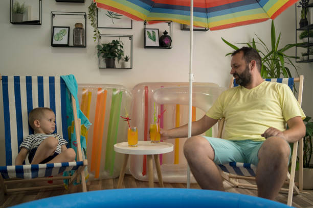istock Cool Father and Son at Home Beach 2159560299