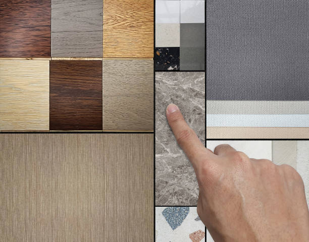 istock interior architect's hand chooses material samples for mood board consists beech wooden veneers, marble, engineering wood tiles, indoor wallpapers, terrazzo, quartz, concrete laminated. 2159560422