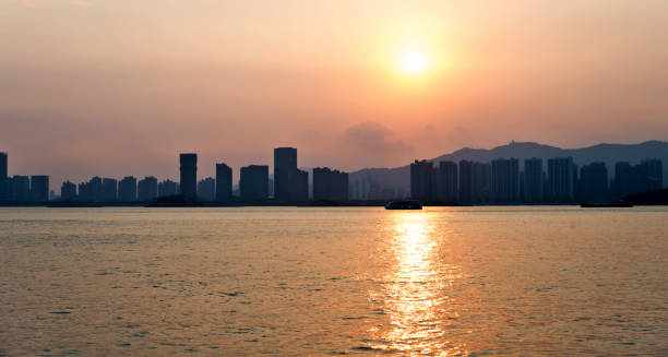 istock City by the sea in sunset 2159560755