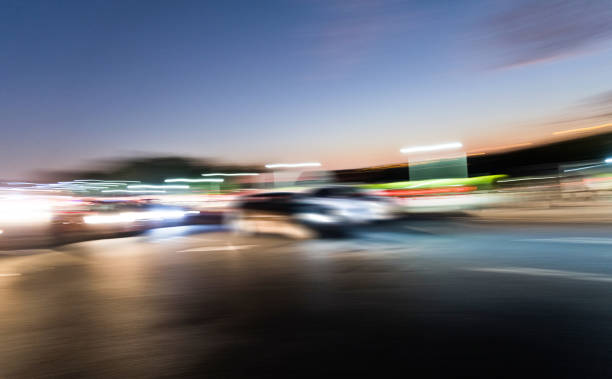 A highly stylized panning shot capturing a red car in motion, with intense motion blur and vibrant colors evoking speed, energy, and dynamic movement. The abstract nature of the image makes it ideal for use in automotive campaigns, motion-based design projects, backgrounds, technology themes, or as conceptual art symbolizing acceleration, urgency, and the fast pace of modern life.