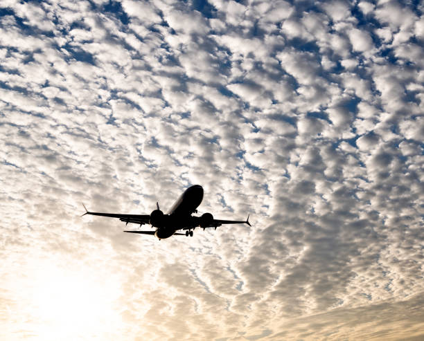 istock An airplane flying in cloud sky 2159561120