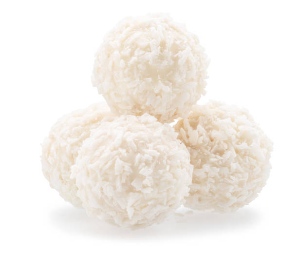 istock Round white chocolate candies covered with blanched coconut on white background. File contains clipping path. 2159561165
