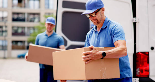 istock Certified technician unloading van, installing furniture in new home 2159561854