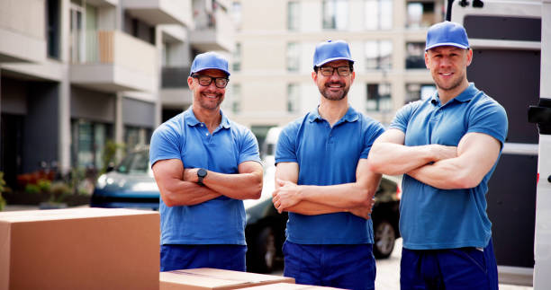 istock Diverse team of professional movers delivering boxes 2159561893