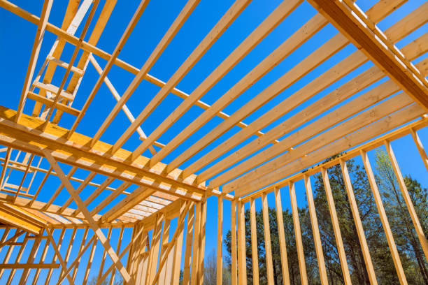 istock Construction a new house included installation of ceiling rafter framework beams 2159563622