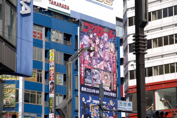 Colorful advertisements for virtual idols stretch several stories high on department stores in Akihabara, a neighborhood in the Chiyoda ward of Tokyo, Japan.\nAkihabara is considered to be the centre of Japanese otaku culture, and is a major shopping district for video games, anime, manga, electronics and computer-related goods.