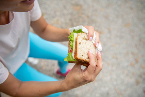 Eating healthy food outdoors in the park