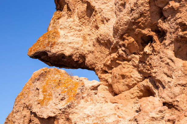istock Bizarre rocks and blue sky. Stone background, natural sand stones 2159568736