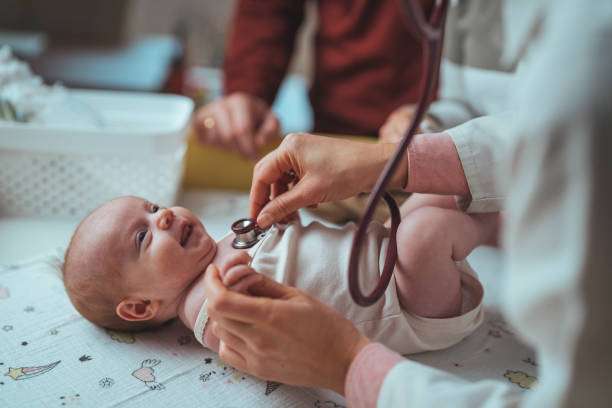 istock Newborn Baby Examination by Pediatrician 2159568901