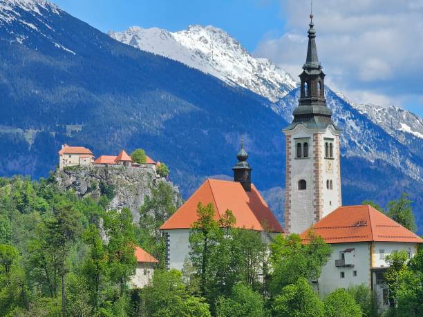 istock Bled island and church scenery with snowy mountains 2159569233
