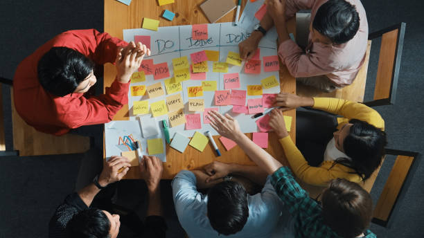 istock Top view of diverse people writing and making scrum task board. Convocation. 2159569907