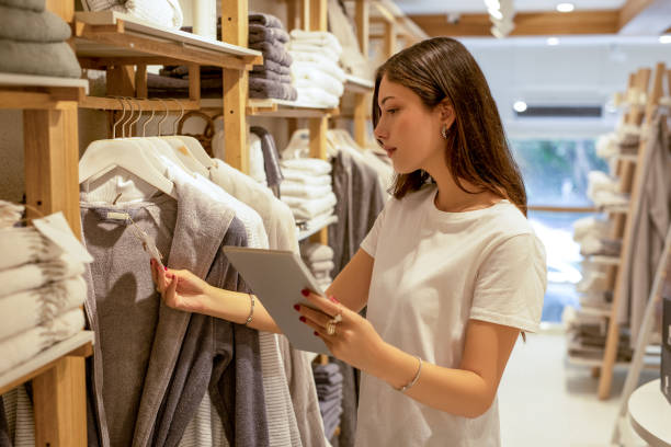 Woman checking stock with digital tablet
