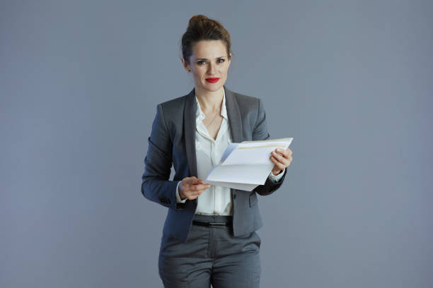 istock woman employee against gray background 2159573550