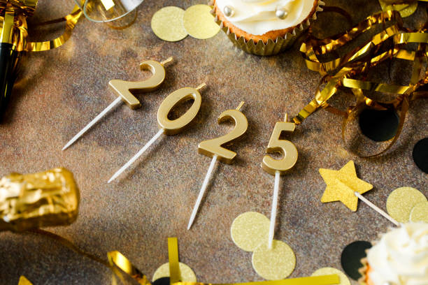 istock 2025 New year candles and confetti on party table 2159577815