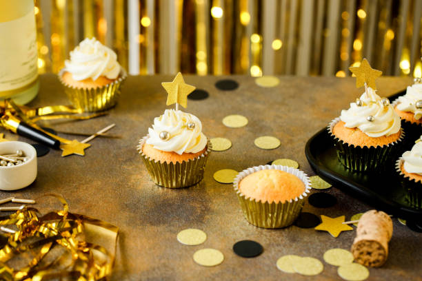 istock New Years Eve celebration table with cupcakes and confetti 2159578460
