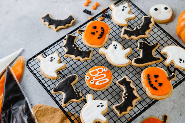 istock Colorful Halloween gingerbread cookies on a gridded tray 2159580212