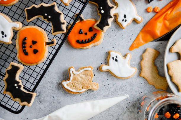 istock Decorating a variety of Halloween cookies with icing 2159580256