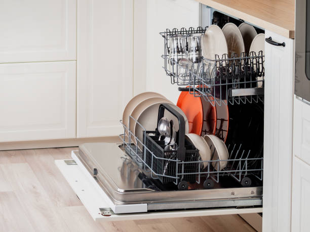 istock Modern dishwasher built into the kitchen unit for washing dishes 2159581335