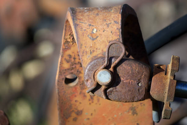 istock weathered piece of machinery. Rust-covered bolt secured by a cotter pin 2159582029