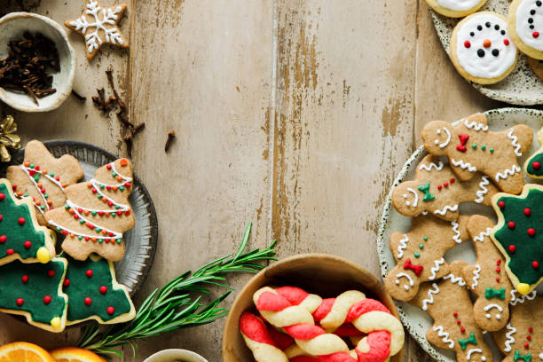 istock Christmas cookies and sweets frame on wooden background 2159582471