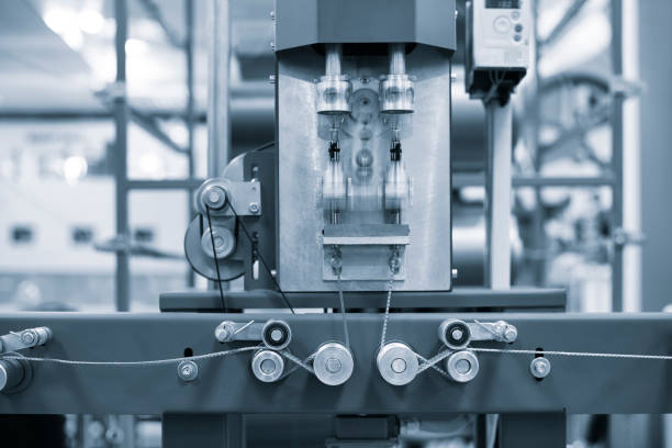 istock Working Industrial machine for weaving multi-colored textile ropes and cords close-up, industrial concept background 2159583776