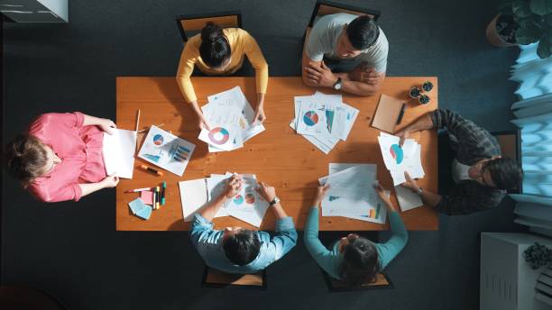 istock Top view of start up business team holding paper while discuss idea. Symposium. 2159583918