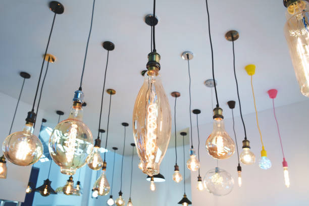 istock A room with many different colored lights hanging from the ceiling. The lights are of various shapes and sizes, creating a unique and eclectic atmosphere 2159585436