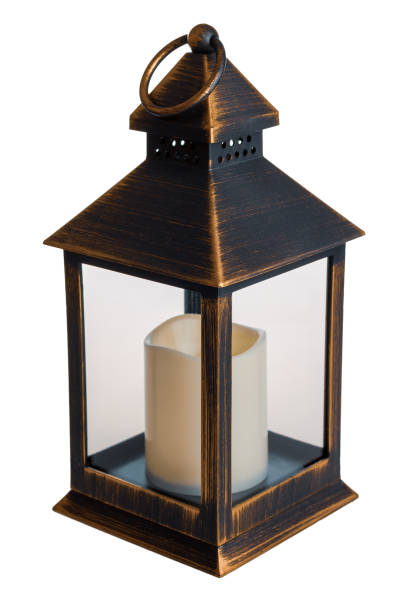 istock Decorative bronze metal lantern with candle for warm, cozy lighting, isolated on white background 2159585617