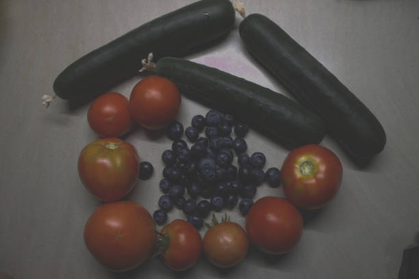 Fresh blueberries cucumber and tomatoes from the garden