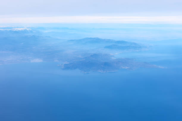 Sky is blue and  the ocean is calm view from above. Breathtaking beauty of nature with blue ocean and coastal mountains