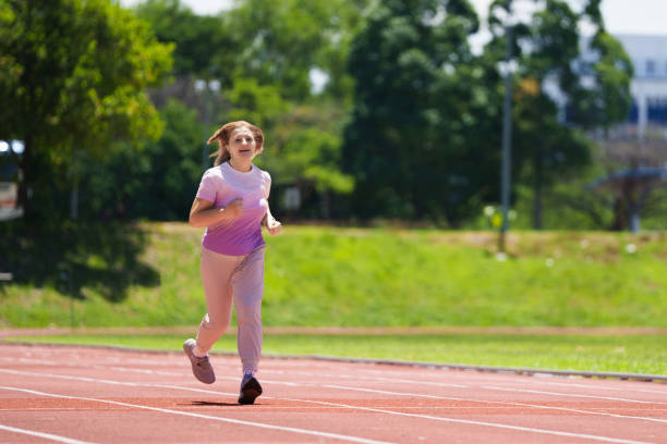 istock Elderly woman exercising. Fit senior lady running. 2159587521