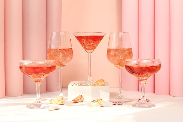 istock Modern summer still life with pink martini, alcoholic cocktail Spritz, champagne and seashells on elegant modern background, minimal concept for bar and holiday party, cafe, advertising banner 2159587843