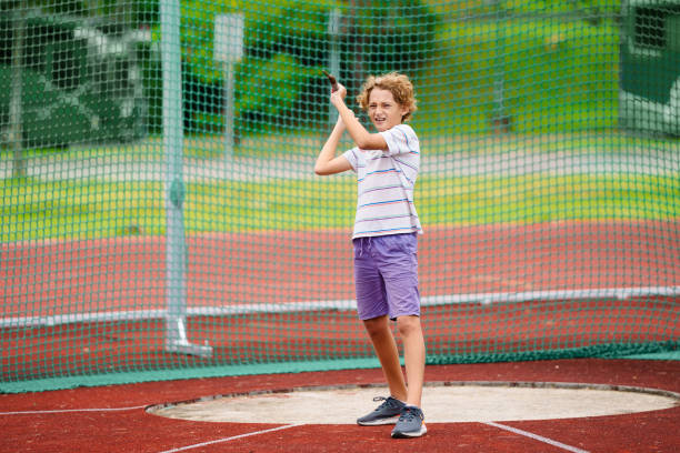 istock Javelin throw competition for kids. Athletics club 2159589224