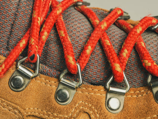 Laces on modern leather hiking boots, macro shot selective focus close-up