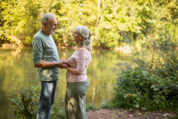 istock Old couple by the river 2159590641