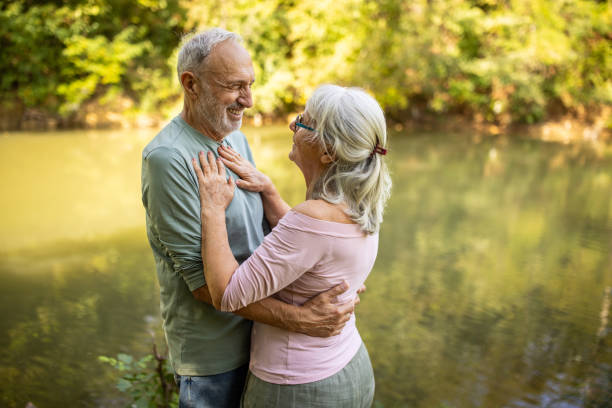 istock Old couple by the river 2159590677