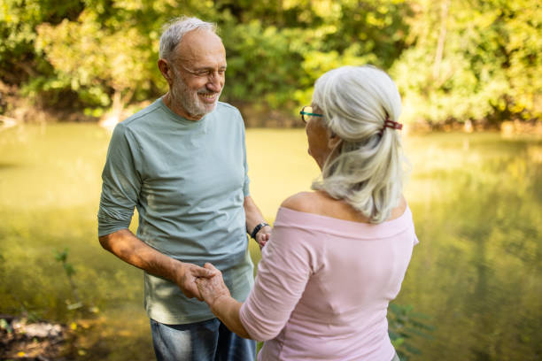 istock Serene Senior Couple by the River 2159590684