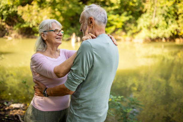 istock Old Couple's Sharing Love by the Riverside 2159590707