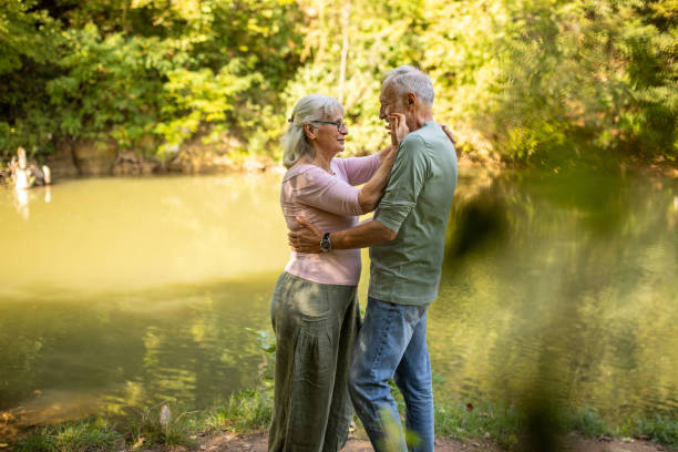 istock Elderly Couple's Sharing Love by the Riverside 2159590783