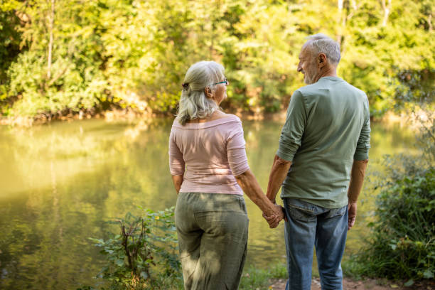 istock Serene Senior Couple by the River 2159590809