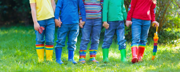 istock Kids in rain boots. Rubber boots for children. 2159590947